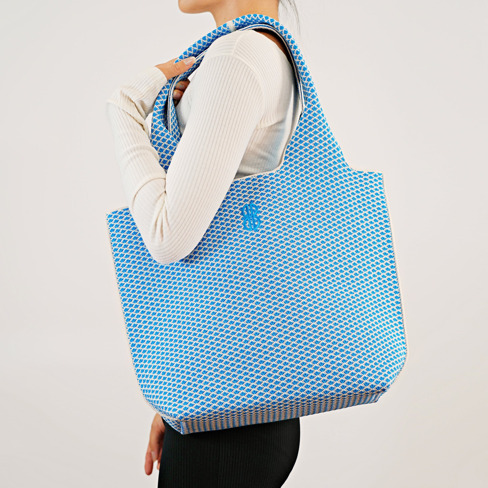 Sutton City Tote - Blue Diamond draped on shoulder