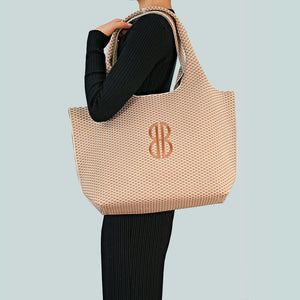 Sutton City Tote - Buckthorn Diamond Monogram draped on shoulder