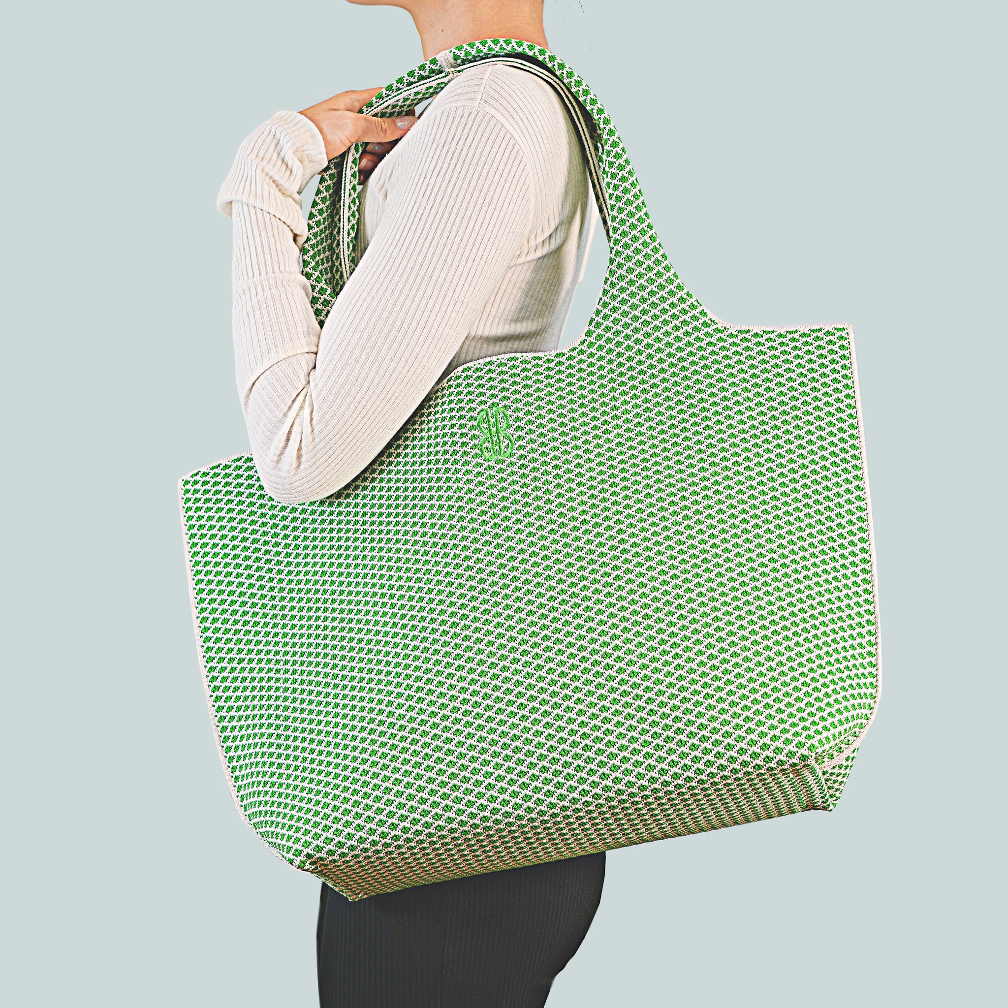 Sutton City Tote - Parakeet Green Diamond draped on shoulder