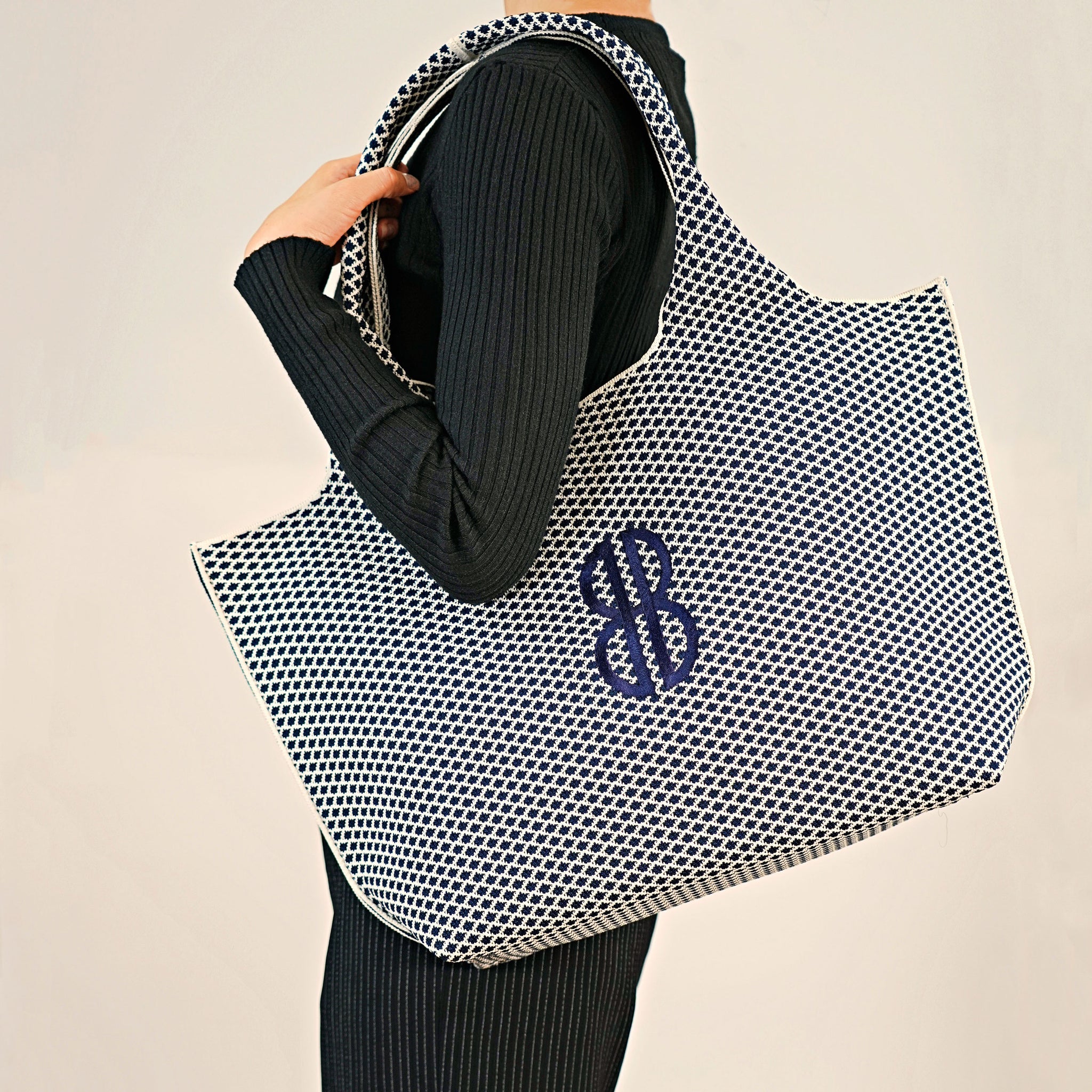 Sutton City Tote - Navy Diamond Monogram draped on shoulder