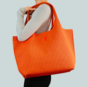 Sutton City Tote - Orange Stripe draped on shoulder