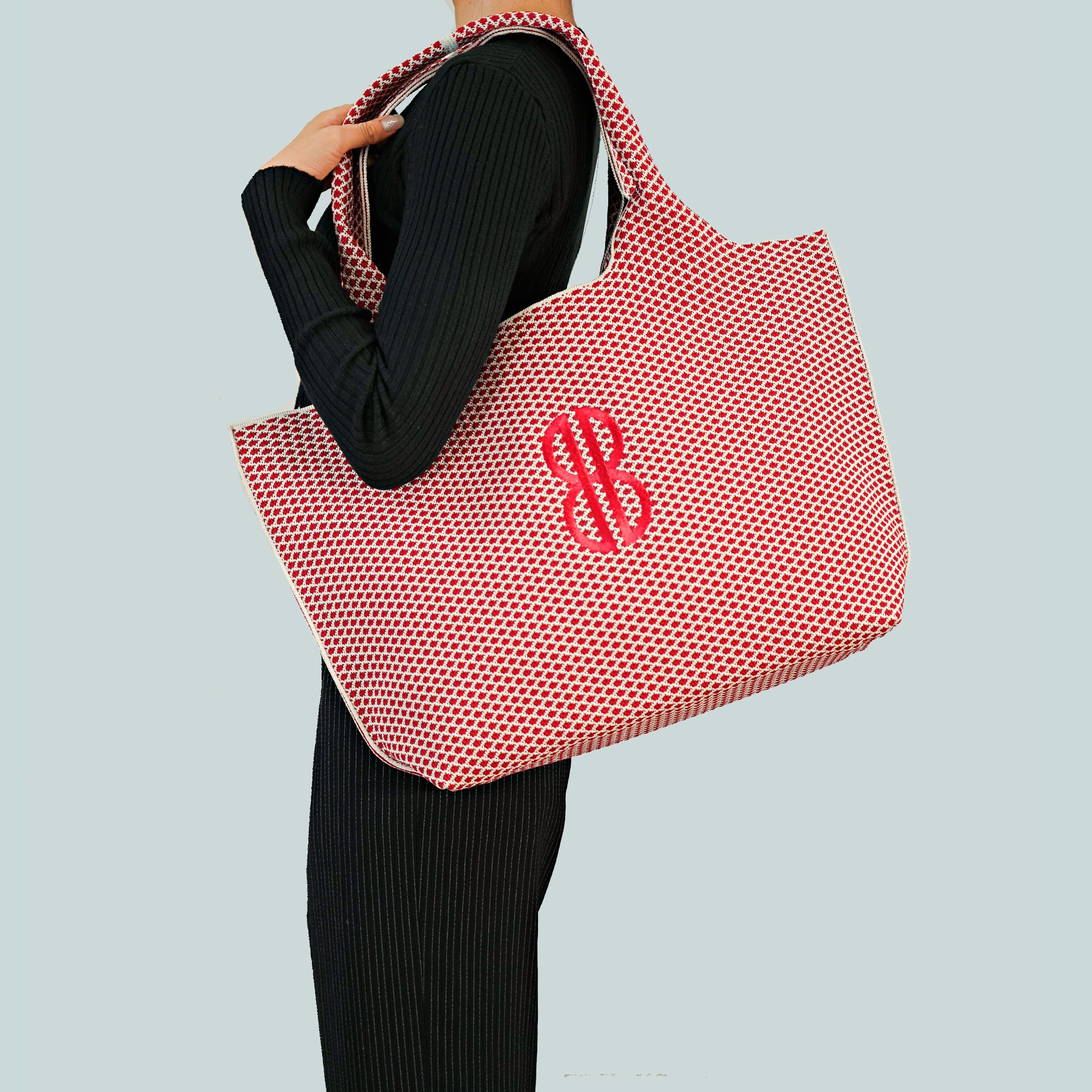 Sutton City Tote - Red Diamond Monogram draped on shoulder