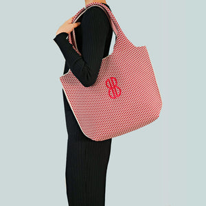 Sutton City Tote - Red Diamond draped on shoulder