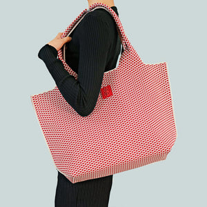 Red Diamond tote draped over shoulder